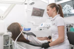 A dentist talking to a patient about sedation dentistry.